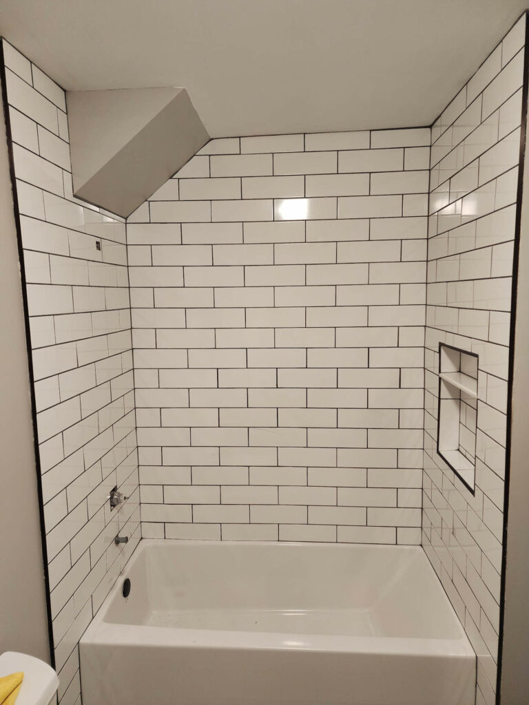 New tile wall in bath