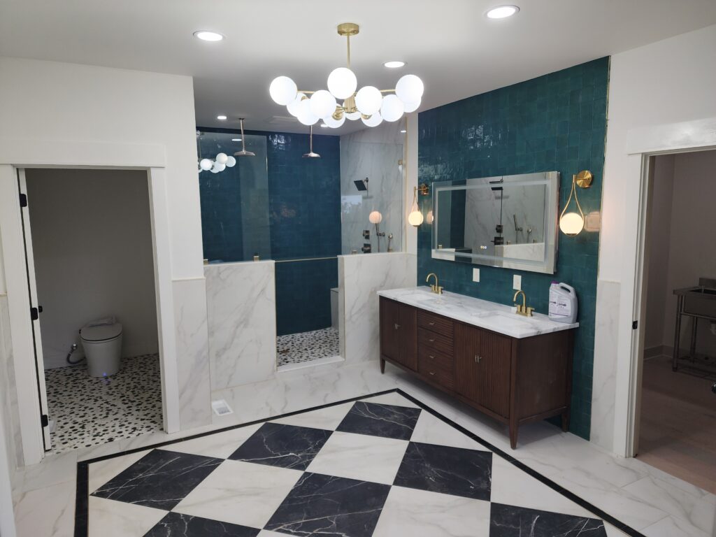 Bathroom remodel with black and white checkerboard tile floor