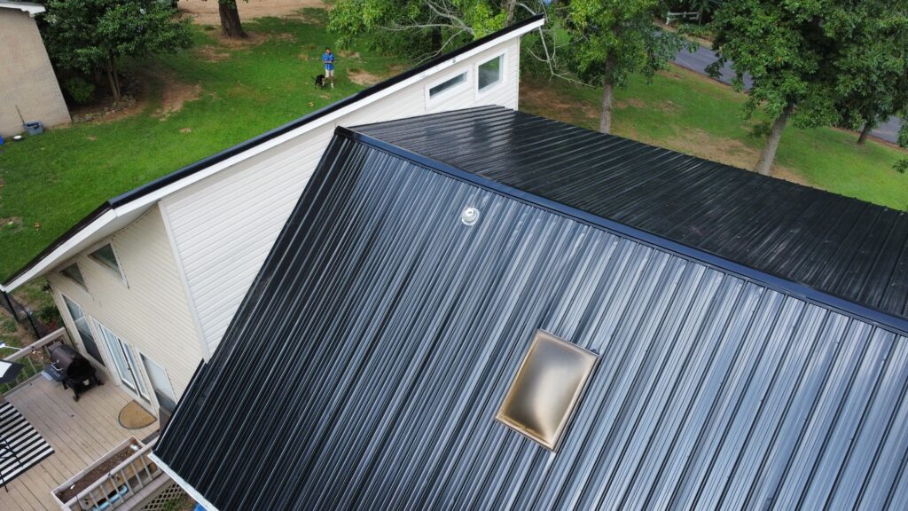 Overhead view of metal rooftop with skylight