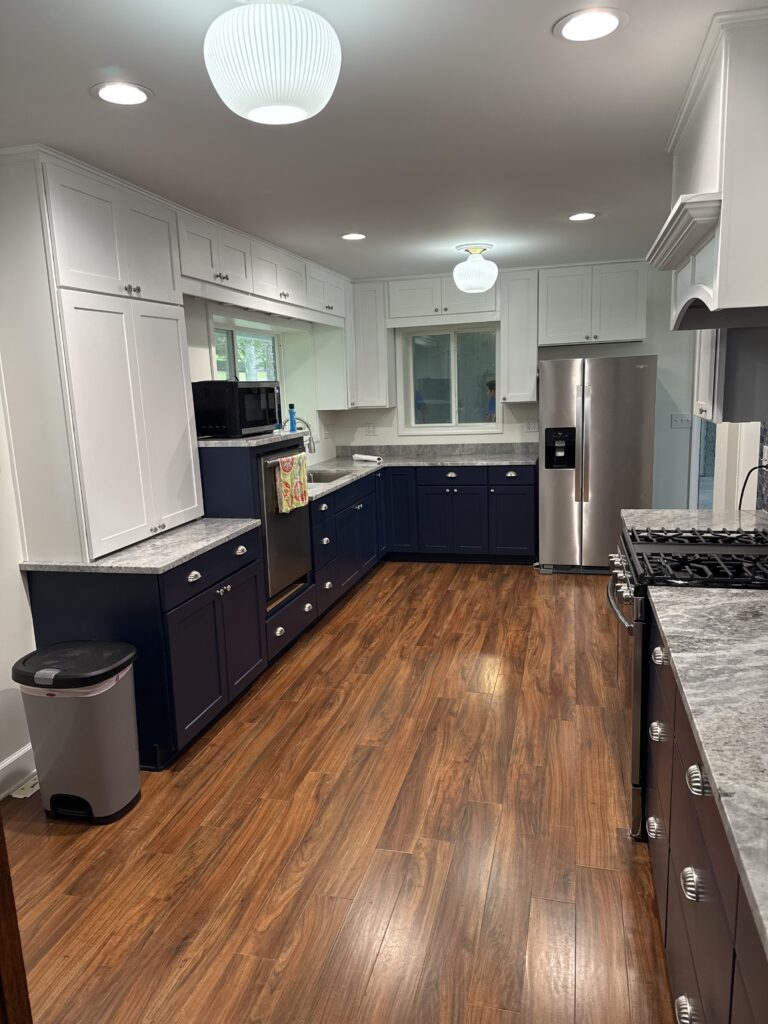 New interior kitchen area with hardwood floors and stone countertops
