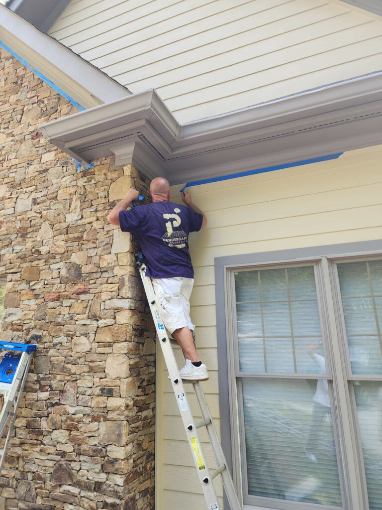 Man painting a house