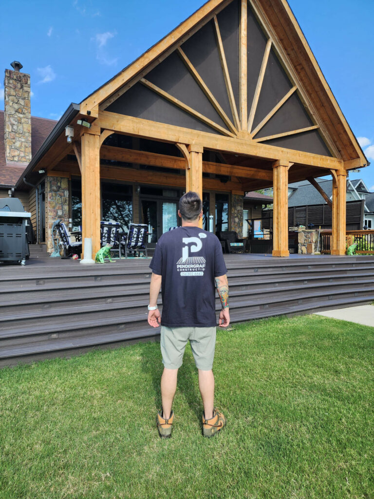 Man standing in front of new porch construction