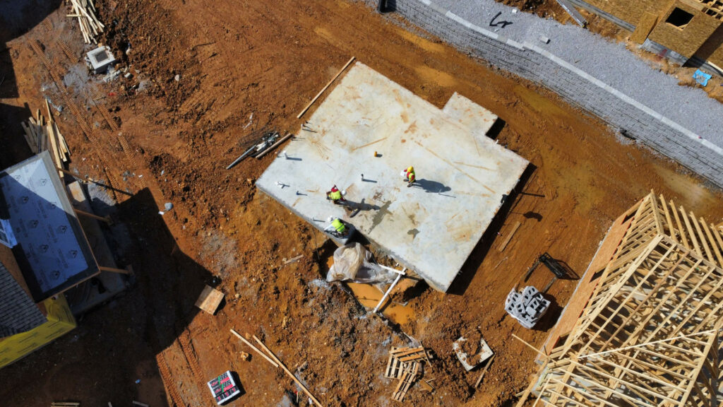 Arial view of men on foundation