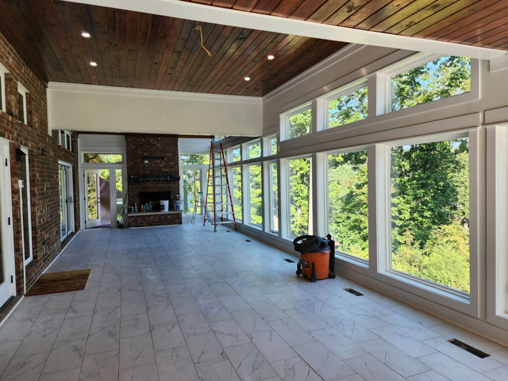 New sunroom addition finished with lake-area views