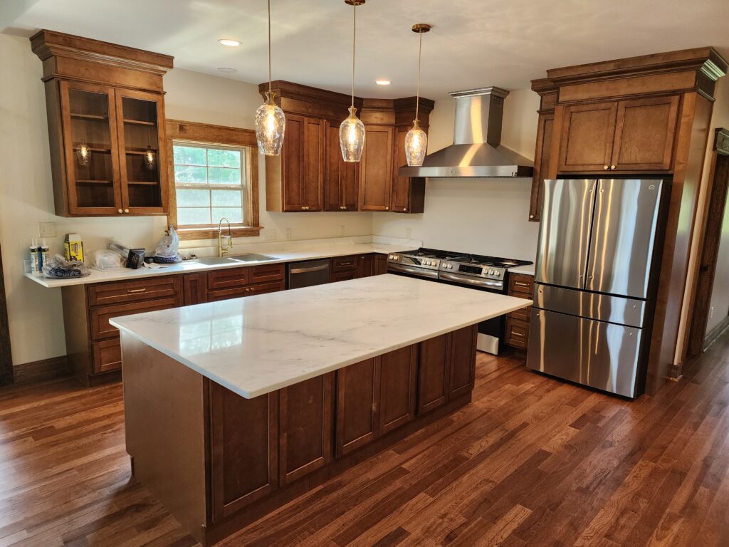 New kitchen with counter and appliances and hardwood floor