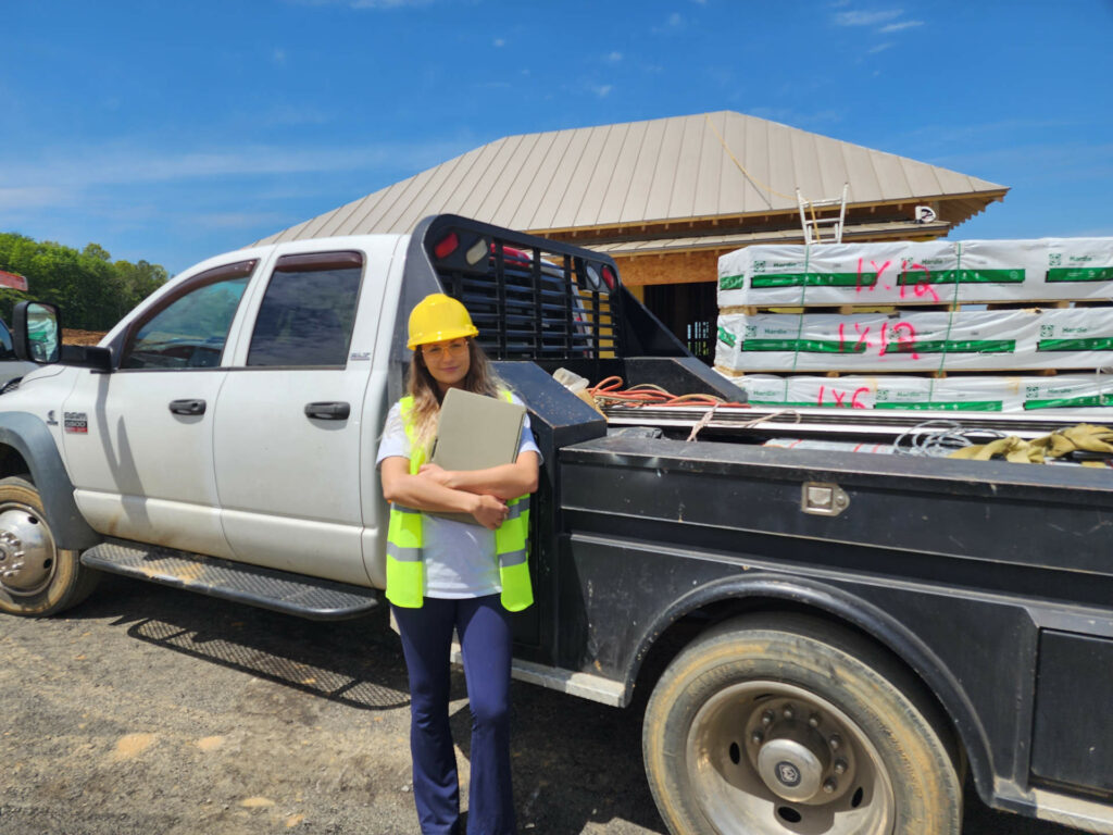 Woman in hardhat at construction site